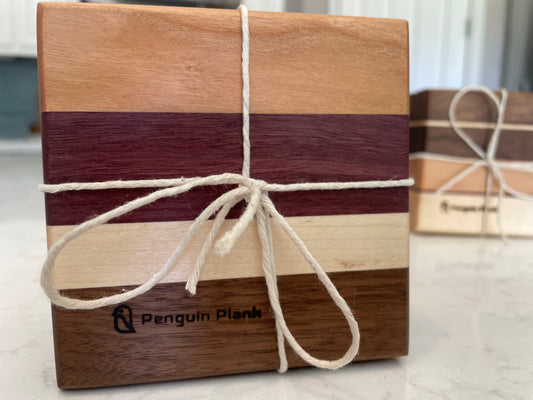 Bundle of wood drink coasters made from cherry, purpleheart, maple and walnut.