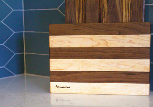 Maple and walnut picnic cutting board .