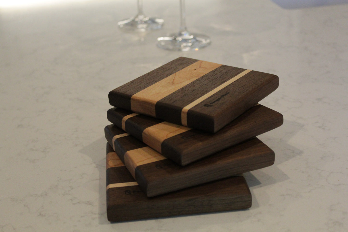 Wine bottle coaster made from walnut, cherry and maple.