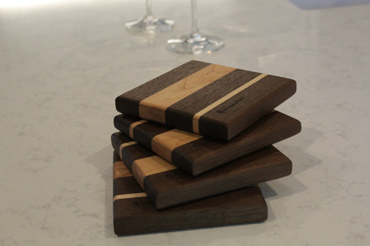 Wine bottle coaster made from walnut, cherry and maple.