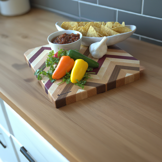 Herringbone cutting board with chips, salsa, peppers and garlic.