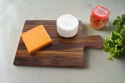 Walnut and zebrawood cheeseboard with handle.