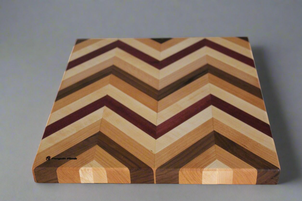 Herringbone cutting board made with maple, cherry, walnut and purpleheart.