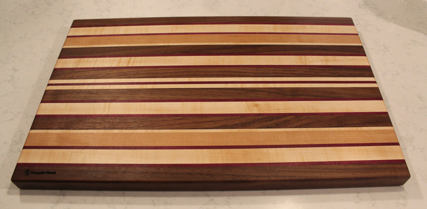 Large Wood Cutting Board, made from a unique blend of Walnut, Maple, Cherry, and Purpleheart strips.