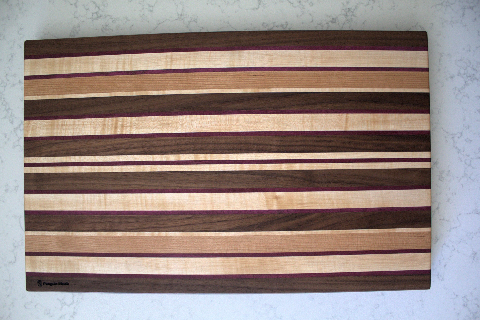 Large Wood Cutting Board, made from a unique blend of Walnut, Maple, Cherry, and Purpleheart strips.